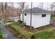 A view of the rear of the house showing the stairs to the upper level and dock at 395 Breakwater Dr, Fishers, IN 46037