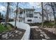 Stunning back of home featuring a textured white exterior with black trimmed windows at 395 Breakwater Dr, Fishers, IN 46037
