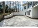 A view of the back of the house showing the textured white brick and back patio at 395 Breakwater Dr, Fishers, IN 46037