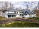 Elegant home featuring a black metal roof, a three-car garage and an extra turret at 395 Breakwater Dr, Fishers, IN 46037
