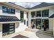 Gorgeous home featuring a three-car garage and an extra turret with windows at 395 Breakwater Dr, Fishers, IN 46037
