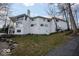 A view of the back of the house showing textured white brick and black trimmed windows at 395 Breakwater Dr, Fishers, IN 46037
