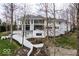 Exterior view of a modern, light-colored home with a well-manicured lawn at 395 Breakwater Dr, Fishers, IN 46037