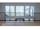 Bright foyer with large windows and black railing overlooking the house at 395 Breakwater Dr, Fishers, IN 46037