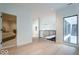 Open-concept foyer with black railing, natural light, and view to an adjacent bedroom at 395 Breakwater Dr, Fishers, IN 46037