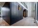 Hallway with modern design elements, including paneled walls, and hardwood floors at 395 Breakwater Dr, Fishers, IN 46037