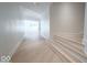 Hallway with hardwood floors leading to the great room at 395 Breakwater Dr, Fishers, IN 46037
