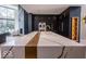 Luxurious kitchen featuring large island with marble countertop, and dark cabinets with gold hardware at 395 Breakwater Dr, Fishers, IN 46037