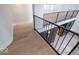 Upstairs landing with hardwood floors and decorative lighting at 395 Breakwater Dr, Fishers, IN 46037