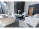 Living room with modern fireplace, comfortable seating, and serene views of the outdoors at 395 Breakwater Dr, Fishers, IN 46037