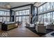 Spacious, open layout with modern furniture and large windows that provide ample natural light at 395 Breakwater Dr, Fishers, IN 46037