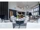 Open concept living space features modern décor, fireplace and an open view into dining area and kitchen at 395 Breakwater Dr, Fishers, IN 46037
