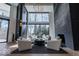 Living area boasts soaring windows, modern decor, and an inviting atmosphere for relaxing at 395 Breakwater Dr, Fishers, IN 46037