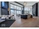 Open-concept living room featuring hardwood floors and expansive windows at 395 Breakwater Dr, Fishers, IN 46037