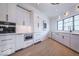 Butler's pantry features custom cabinets and plenty of storage with stainless appliances at 395 Breakwater Dr, Fishers, IN 46037