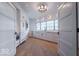 Butler's pantry features custom cabinets and plenty of storage with stylish, modern lighting at 395 Breakwater Dr, Fishers, IN 46037