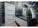 Stylish powder room boasts eye-catching wallpaper, modern fixtures and finishes at 395 Breakwater Dr, Fishers, IN 46037