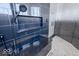 Custom shower with black marble accents, a built-in bench, and upscale shower fixtures at 395 Breakwater Dr, Fishers, IN 46037