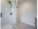 Glass enclosed shower with black hardware and patterned tile at 395 Breakwater Dr, Fishers, IN 46037