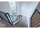 View of the staircase featuring black railings and modern architecture at 395 Breakwater Dr, Fishers, IN 46037