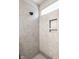 Modern shower with tiled walls, a niche, and a rain shower head at 401 Thomas Point Dr, Fortville, IN 46040