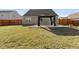 Backyard view showcasing a well-maintained lawn, a gazebo, and a wooden fence at 4213 Katie Ln, Indianapolis, IN 46239