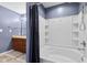 Bathroom featuring double sinks, a shower/tub with curtain, and ample lighting at 4213 Katie Ln, Indianapolis, IN 46239