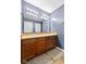 Well-lit bathroom featuring double sinks with sleek faucets, and a large mirror above at 4213 Katie Ln, Indianapolis, IN 46239