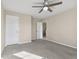 Comfortable bedroom has neutral carpet, a ceiling fan, and light-colored walls providing a serene and cozy atmosphere at 4213 Katie Ln, Indianapolis, IN 46239