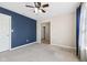 Bedroom featuring soft gray carpet, a ceiling fan, and natural light at 4213 Katie Ln, Indianapolis, IN 46239