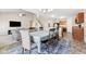 Inviting dining area with an elegant chandelier, seating for six, and easy access to the living room and kitchen at 4213 Katie Ln, Indianapolis, IN 46239