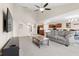 Open-concept living room boasts a vaulted ceiling, seamless flow to the kitchen, and hardwood flooring at 4213 Katie Ln, Indianapolis, IN 46239