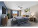 Stylishly decorated bedroom with ceiling fan, plush carpet, window, and furniture providing a comfortable retreat at 4213 Katie Ln, Indianapolis, IN 46239