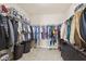 Spacious walk-in closet equipped with ample hanging racks, shelving, and drawers at 4213 Katie Ln, Indianapolis, IN 46239