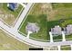 Aerial view of home showcasing manicured lawn, mature trees and landscaping, set within a well-planned neighborhood at 4255 Kettering Dr, Zionsville, IN 46077