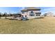 Expansive backyard featuring a pergola, seating area, and ample green space at 4255 Kettering Dr, Zionsville, IN 46077