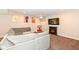 Spacious finished basement with comfortable seating, fireplace, and TV at 4255 Kettering Dr, Zionsville, IN 46077