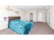This inviting bedroom has a walk in closet and an ensuite bathroom creating a private and comfortable space at 4255 Kettering Dr, Zionsville, IN 46077
