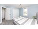 Comfortable bedroom with carpet flooring, large closet and bright windows at 4255 Kettering Dr, Zionsville, IN 46077