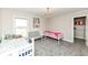 Bright ' bedroom with carpet flooring, two beds, and a large closet at 4255 Kettering Dr, Zionsville, IN 46077