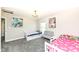 Bright ' bedroom with carpet flooring, two beds and colorful wall art at 4255 Kettering Dr, Zionsville, IN 46077
