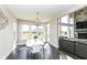 Bright dining area with views of the backyard and is connected to the living room area at 4255 Kettering Dr, Zionsville, IN 46077