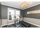 Bright exercise room with a chandelier, large window, and workout equipment at 4255 Kettering Dr, Zionsville, IN 46077