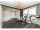 Versatile exercise area with dark floors, elegant lighting, and access to the entryway at 4255 Kettering Dr, Zionsville, IN 46077