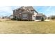 Charming two-story brick home featuring a three car garage and well-manicured lawn at 4255 Kettering Dr, Zionsville, IN 46077