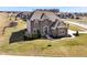 Beautifully landscaped corner lot home with a spacious lawn, playground, and sidewalks at 4255 Kettering Dr, Zionsville, IN 46077