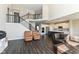 Bright foyer featuring a staircase and views of an open-concept kitchen with an island at 4255 Kettering Dr, Zionsville, IN 46077