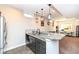 Kitchen area featuring stainless steel appliances, granite countertops and views of a home office at 4255 Kettering Dr, Zionsville, IN 46077