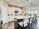 Modern kitchen featuring a large island with seating and pendant lighting at 4255 Kettering Dr, Zionsville, IN 46077