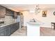 A kitchen space with granite counters, stainless steel appliances and decorative lighting at 4255 Kettering Dr, Zionsville, IN 46077